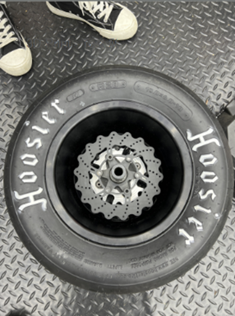 Test fit rotor mounted inside the wheel to verify packaging within the hub area and tire envelope.