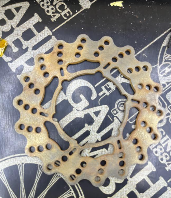 The final rotor as manufactured — surface oxidation from improper storage after machining.