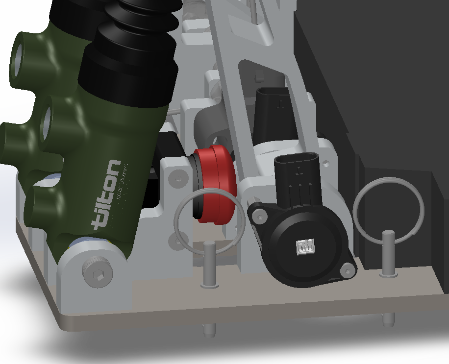 CAD detail of the BOTS packaging — brake over travel switch tucked beside the master cylinders and quick release locking pins.
